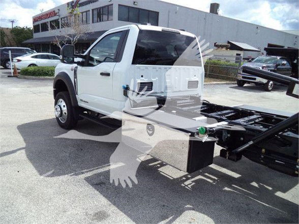 Ford F-550 chassis cab towing truck with white cab, view of side and open bed, VIN 1FDUF5GT8RDA08894, stock J08894, new unit.