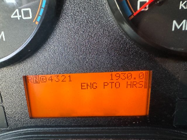 Dashboard display showing text: '04321 1950.0 ENG PTO HRS' with gauge faces around.