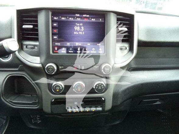 Ram 4500 interior center stack with touchscreen display showing radio interface and climate controls.