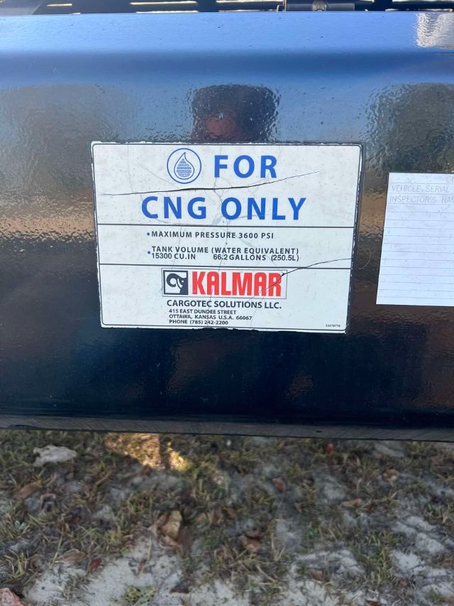 Tank tag plate reading FOR CNG ONLY with Kalmar logo and maximum pressure 3600 PSI and tank volume 15300 cu in (66.2 gallons) on blue tank