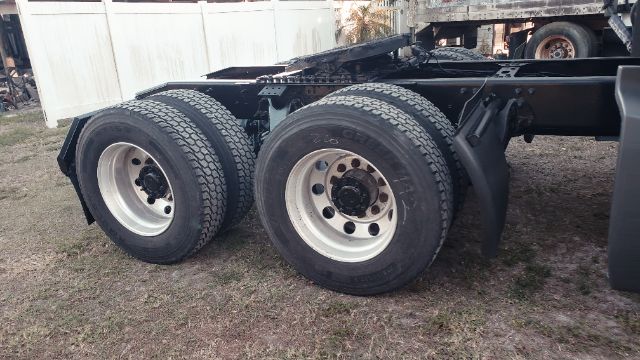 2019 International conventional truck rear wheel setup showing dual rear axles and tires.