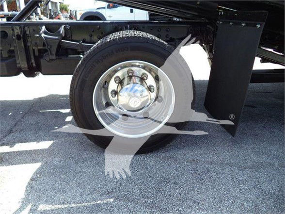 Truck wheel and chassis undercarriage with 'TD 70-80' tire markings and wheel hub visible.