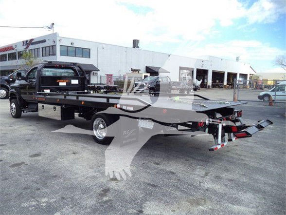 2023 International CV tow truck chassis showing flatbed with ramps and rear hitch, VIN 1HTKTSWK6PH441635 visible, stock J41635.