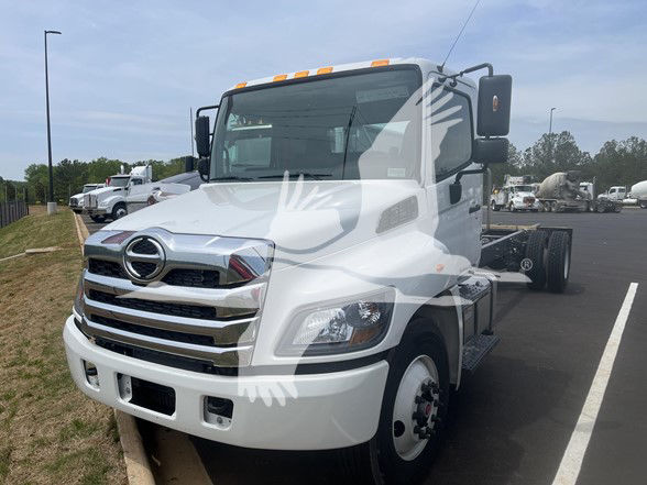 White 2026 Hino L6 cab and chassis truck in a parking lot.