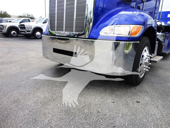 Front lower chrome bumper area of a blue 2022 Peterbilt 337 truck with headlight, wheel, and part of grille visible.
