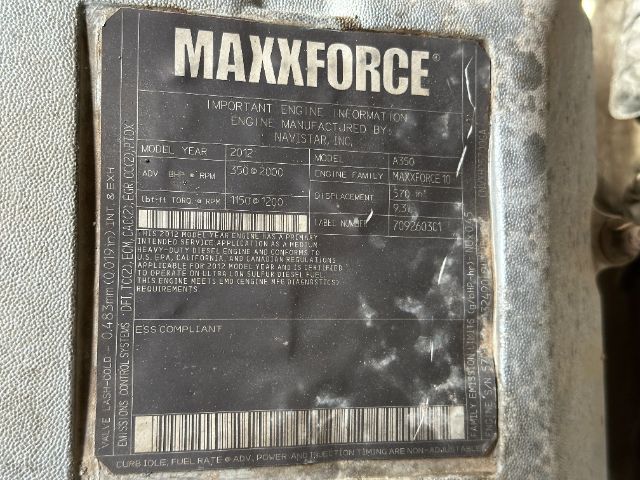 MaxxForce engine data plate showing model year 2012, Navistar MAXXFORCE 10 engine family, displacement 5700? cubic inches, and serial details.