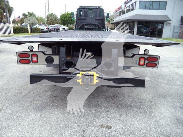Truck bed of a 2016 Peterbilt 348 with rear view showing hitch and taillights.
