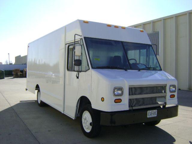Box-style white Freightliner MT45 step van with cargo box, side mirrors, front bumper, headlights. License plate visible on front bumper, stock number MAG77282.