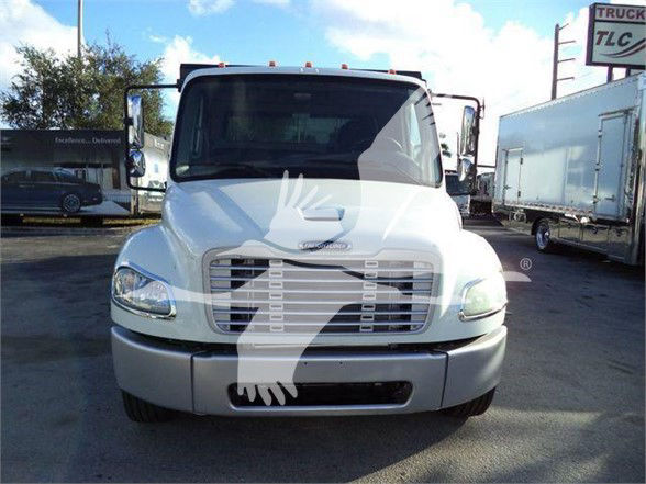 Front view of a 2012 Freightliner Business Class M2 106 truck with large grille, headlights, and bumper.