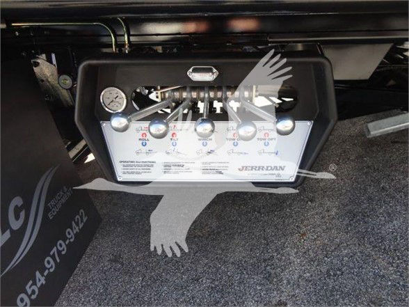 Panel with gauges and controls labeled JERRDUN air line system mounted on a truck equipment box.