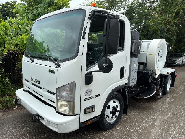 Isuzu NPR-HD street sweeper truck, white cab, side-mounted cleaning apparatus and rear blower unit visible.