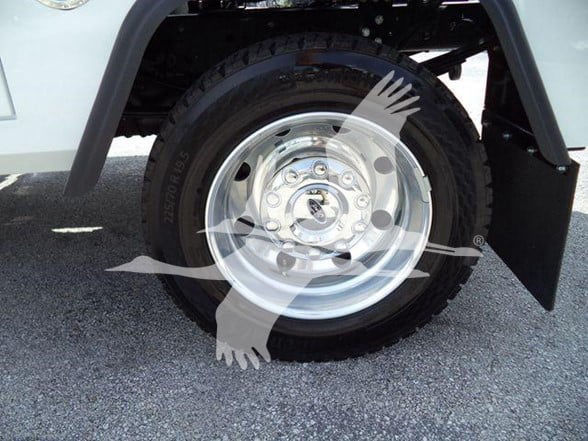 Wheel and tire of a 2024 Ford F450 with shiny steel rim, black tire, and partial front fender showing.