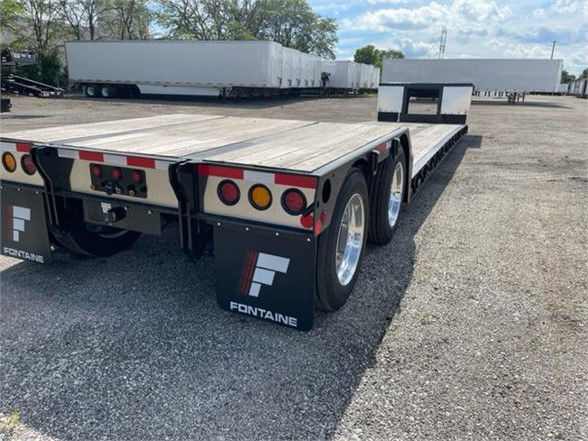 Fontaine Renegade 18 LX40 double drop deck trailer showing rear and side with taillights, mud flaps, and dual axles.