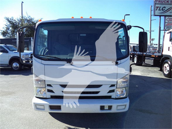 Isuzu NRR dump truck front view with stock number 18FTDUMPNRRFM in a dealership lot.