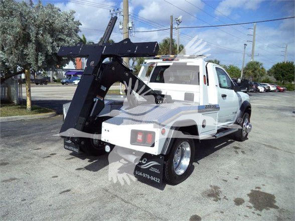 Ram 4500 tow truck with heavy-duty hydraulic equipment and rear mounting hoist, white cab, stock number J45740.
