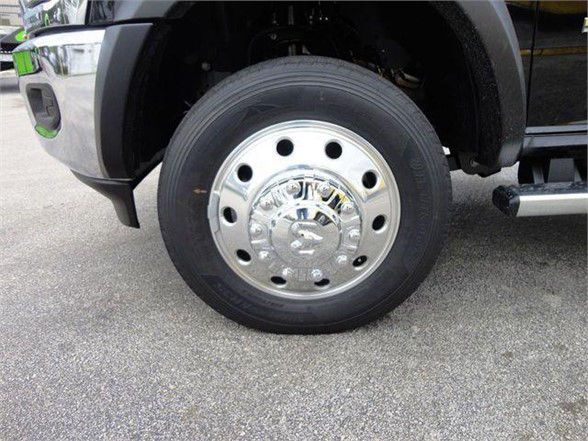 Close-up of Ram 4500 wheel with shiny steel hubcap and tire, showing the front wheel assembly.