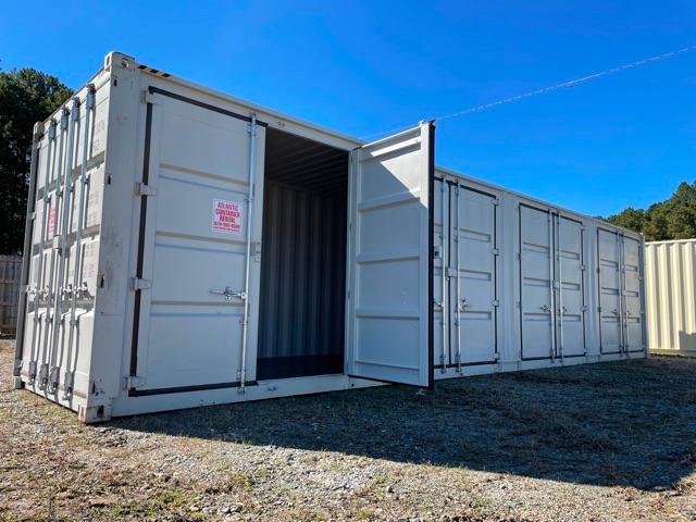 40' open side shipping container with multiple compartments, doors open at center showing interior ribbed walls