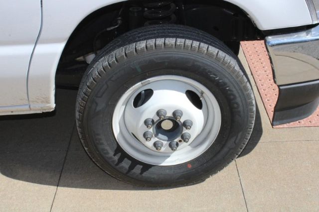 Wheel of a 2024 Ford E450 box truck showing steel rim and lug nuts.