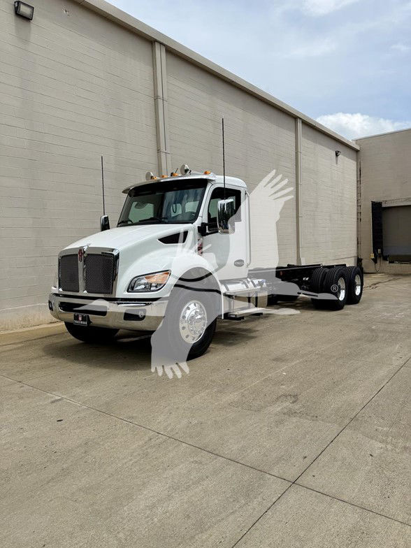 Kenworth T480 cab and chassis truck in white, front three-quarter view showing grille, headlights, cab, and chassis with dual rear axles.