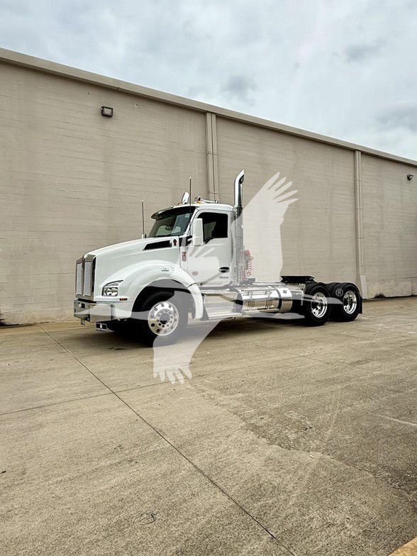 Kenworth T880 conventional daycab tractor in white, side view, 6x4 rear cab with chrome fuel tanks and dual rear axles.