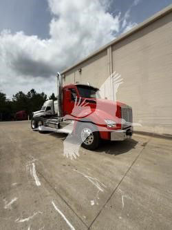 Kenworth T880 truck in a three-quarter front view showing red hood and white cab with a trailer behind.