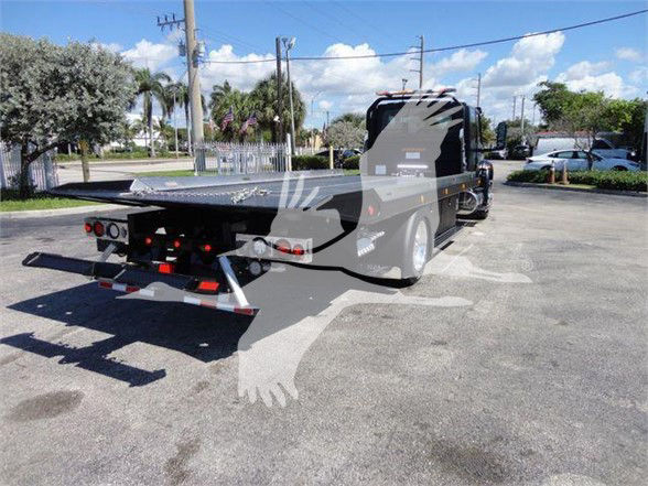 Tow truck with flatbed rear, 2022 International MV, side and rear view showing VIN plate and stock number J43803.