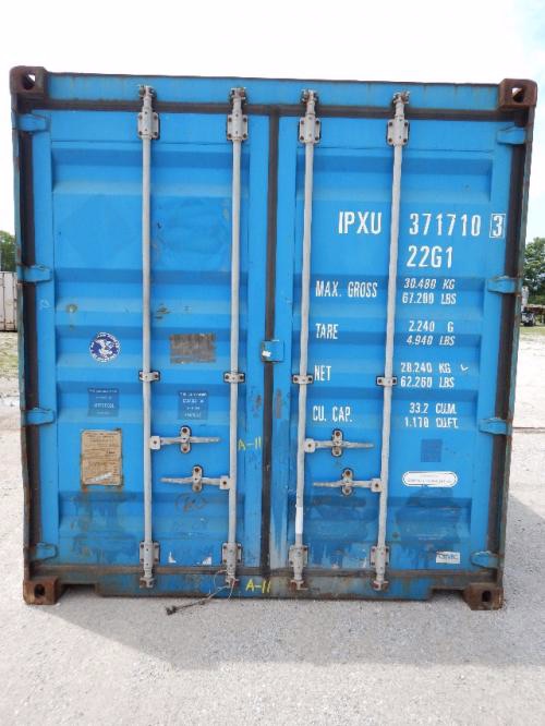 Container door with white printed specs: IPYU 371710 3 22G1, MAX GROSS, TARE, NET, CUBIC CAP. Blue weather-tight shipping container with vertical lock bars.
