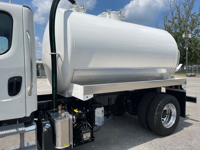 Sewer service tanker truck side view showing cylindrical stainless steel tank, pump, and dual rear wheels.