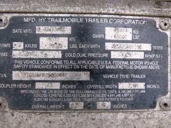 Trailer data plate showing MFD. BY TRAIL MOBILE TRAILER CORPORATION with fields for GVWR, GAWR, cold dual pressure, and other specs.