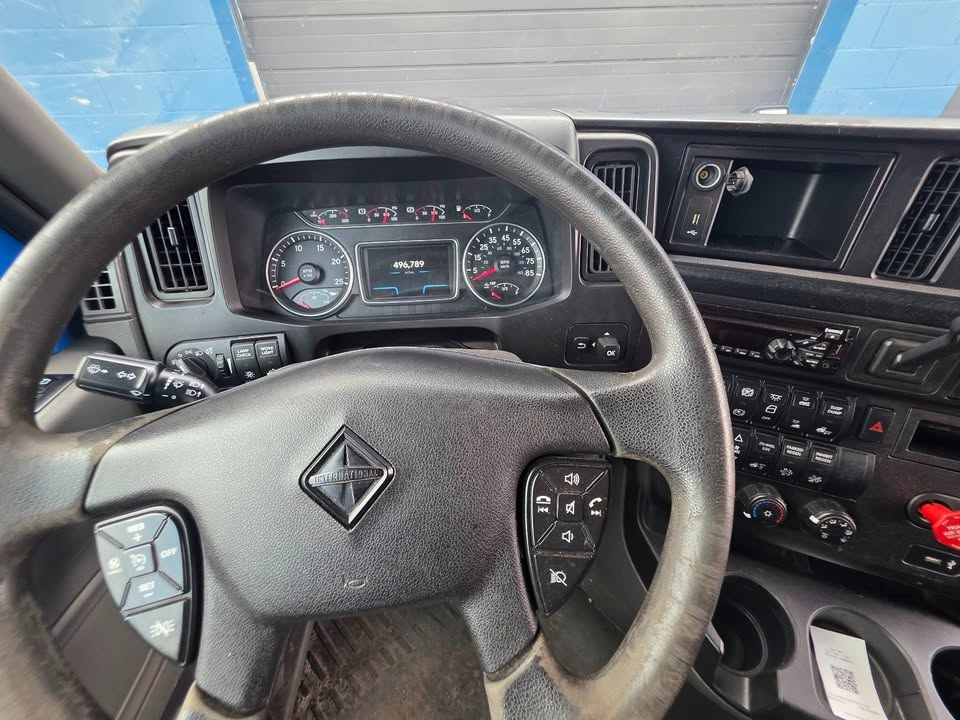 Dashboard and steering wheel of a 2018 International LT Cummins ISX 10 speed truck showing instrument cluster and steering column controls.