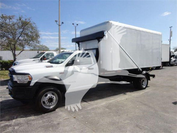 2024 Ram 5500 HD box truck with a white cab and cargo box, front left view. No visible text on the truck panels.