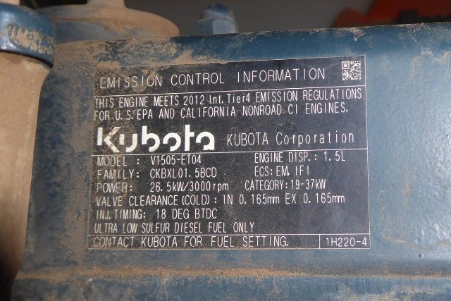 Label on engine showing emission information: Kubota logo, Kubota Corporation, Model V1505-ET04, Family CKBXL01.5BCD, Engine Disp. ~1.5L, Power 26.5kW / 3000 rpm, Valve clearance Cold 0.165mm EX 0.165mm, Injt timing 18 deg BTDC, Ultra Low S